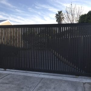 Black vertical slat sliding gate with 10mm gap aluminum design for modern residential driveway security